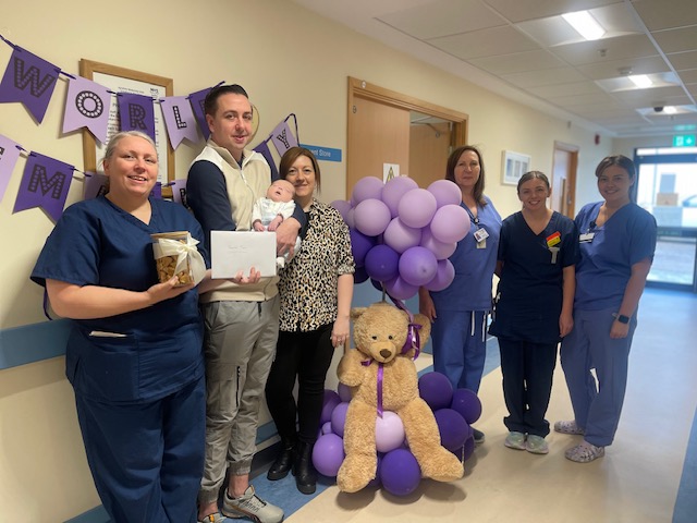 Group standing with cheque from left to right Gail Dobie, Ryan, baby Emry and Emma, neonatal staff Marion Breckenridge, Rachel Buller, Hayle Kay