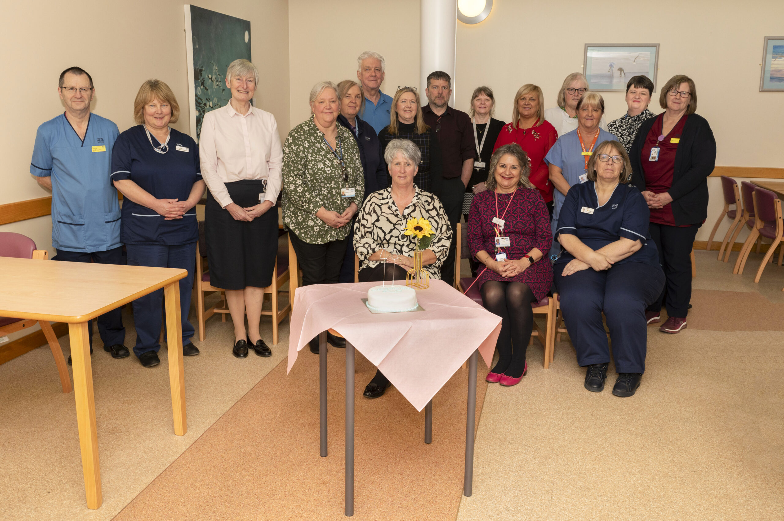 Staff from Crosshouse being presented with 40 years' service pin.