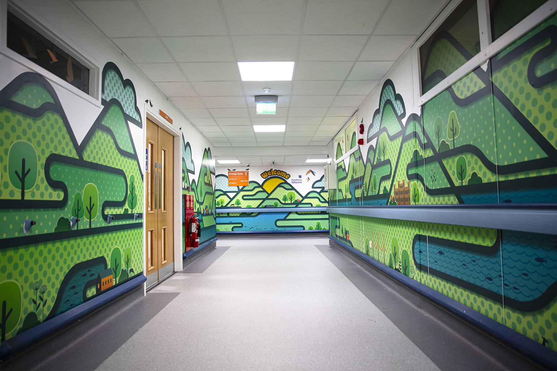 Hallway into children's ward showing the colourful panels on the walls as pat of colour for crosshouse