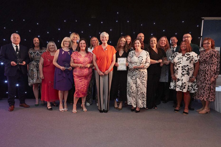 Claire Burden, Chief Executive, (centre) joins all the winners of Ayrshire Achieves awards on stage