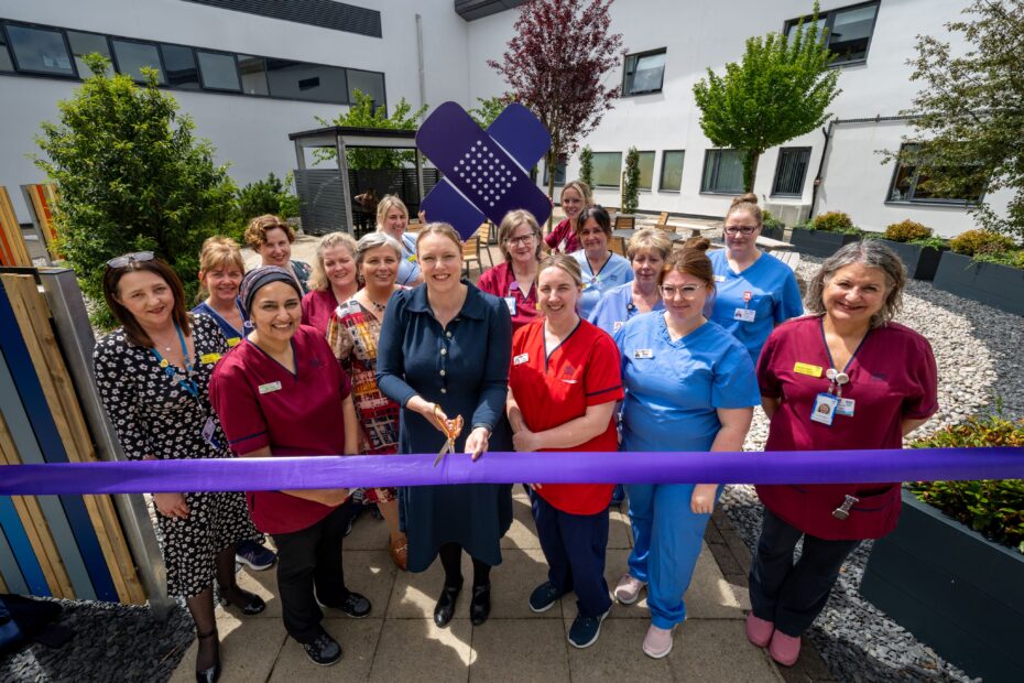Group of Ayrshire Maternity Unit staff cutting ribbon at new garden funded by Crosshouse Children's Fund